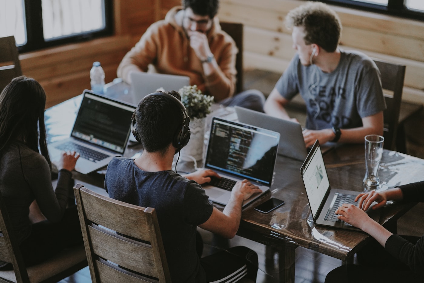 The team working together around a table